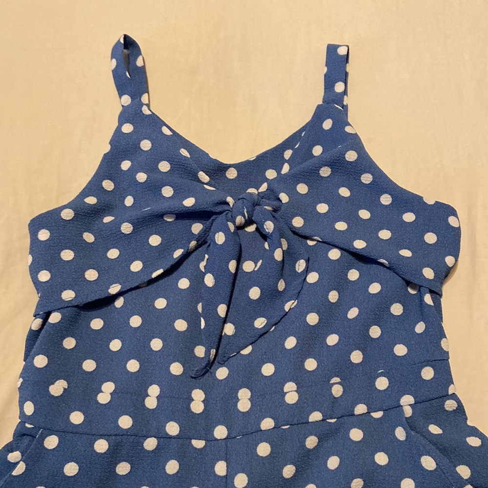 Blue polka dot jumpsuit. Size 10 (kids). Fits true to size. The brand is Lilt.